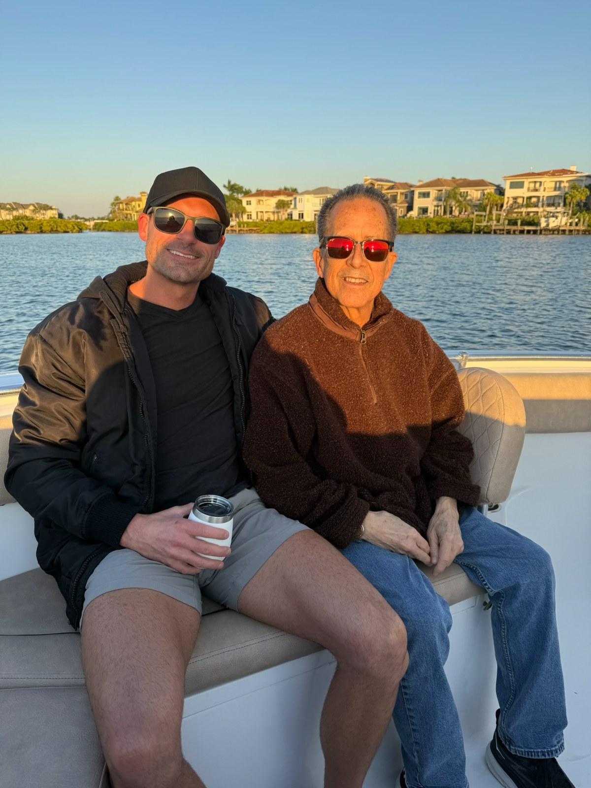 Matt Kavanaugh, owner of the agency, with his father on the water in Tampa Bay